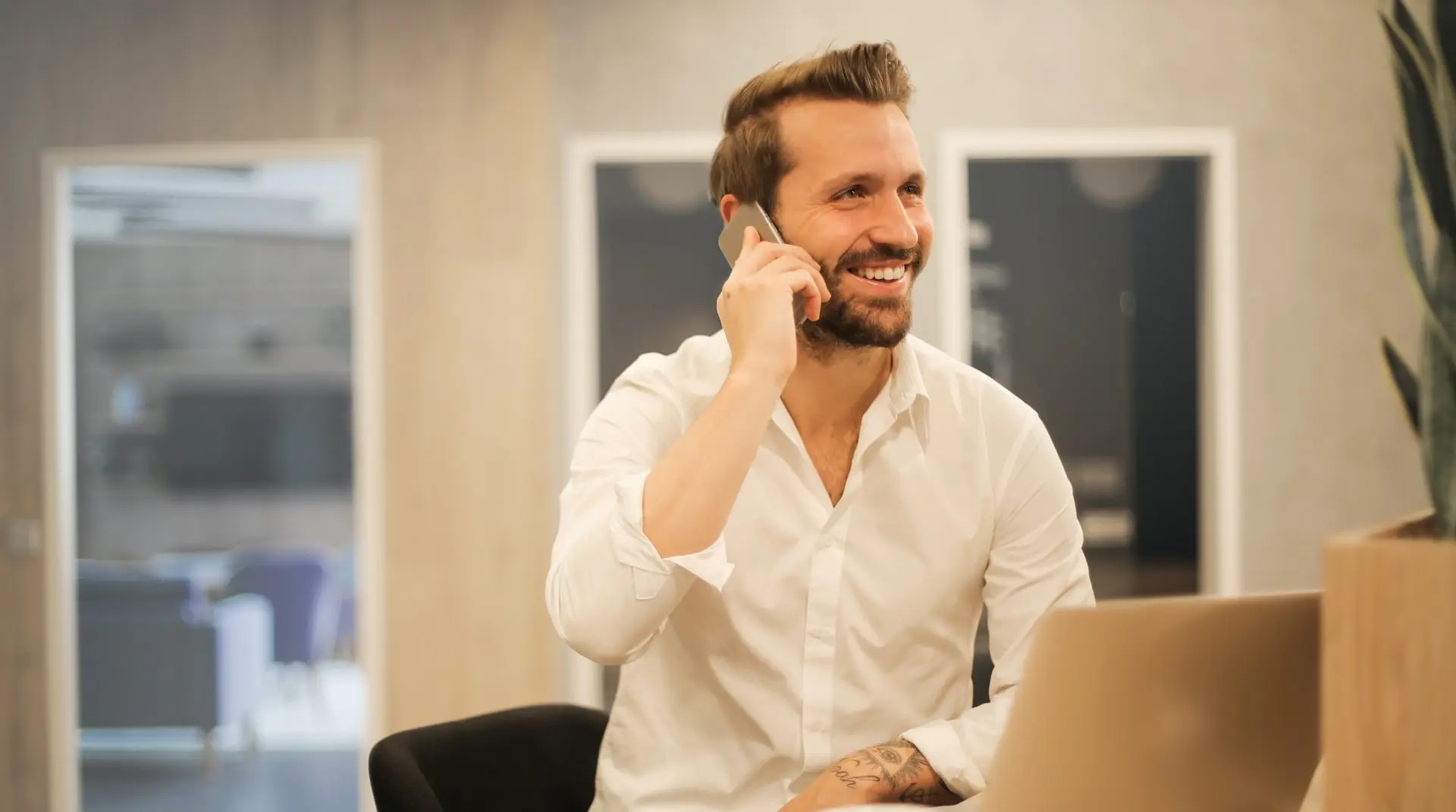 man using smartphone on chair